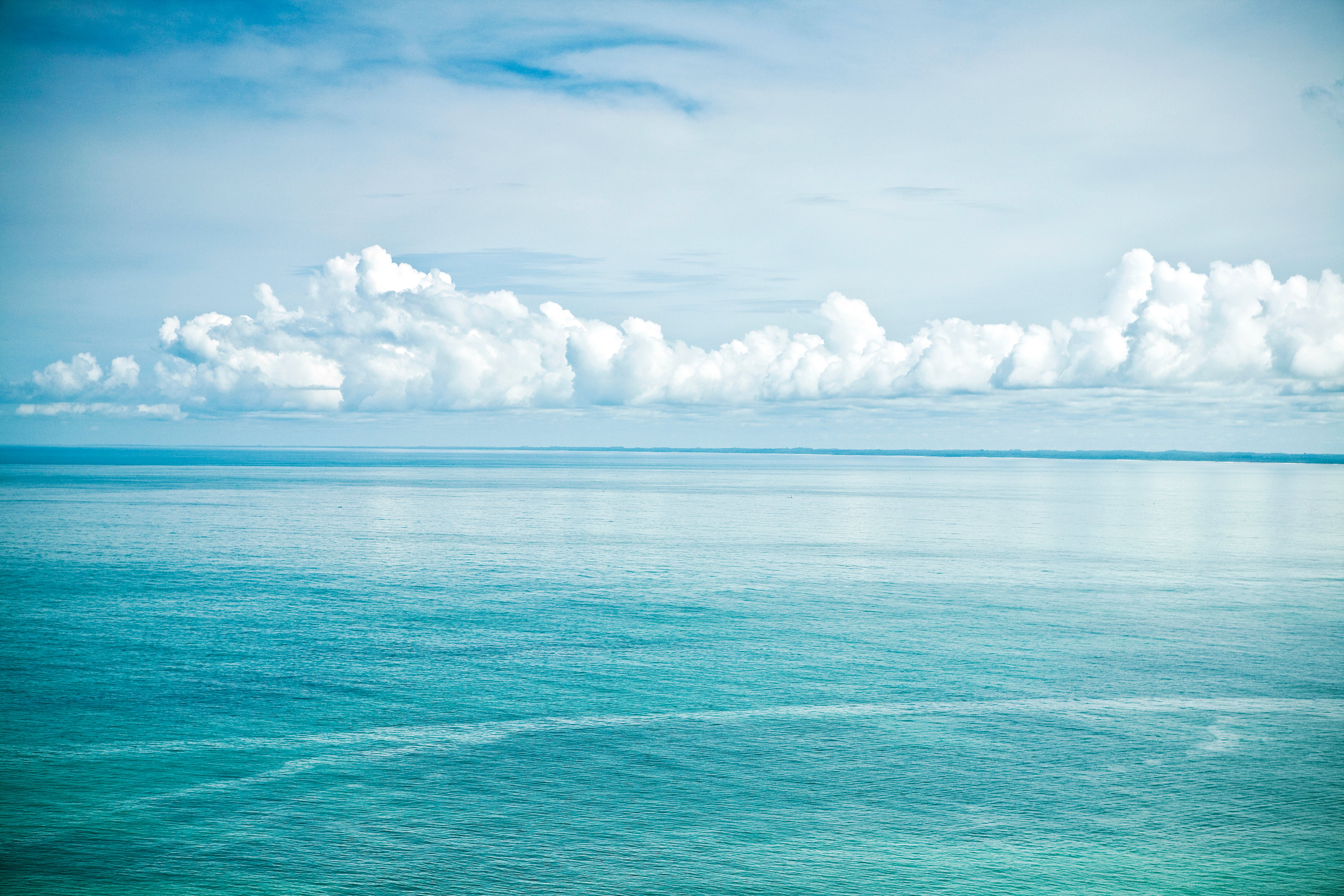 Biophilic Photo of Blue Ocean, Sky and Clouds by Jaime Kowal